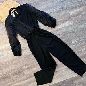 Vintage 1980’s black metallic‎ puff sleeve jumpsuit